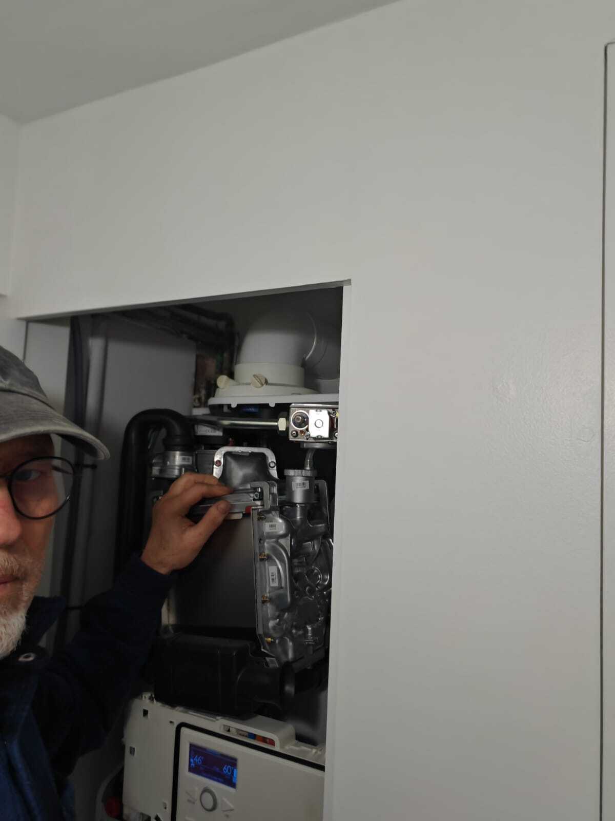 Heating engineer working on boiler installation